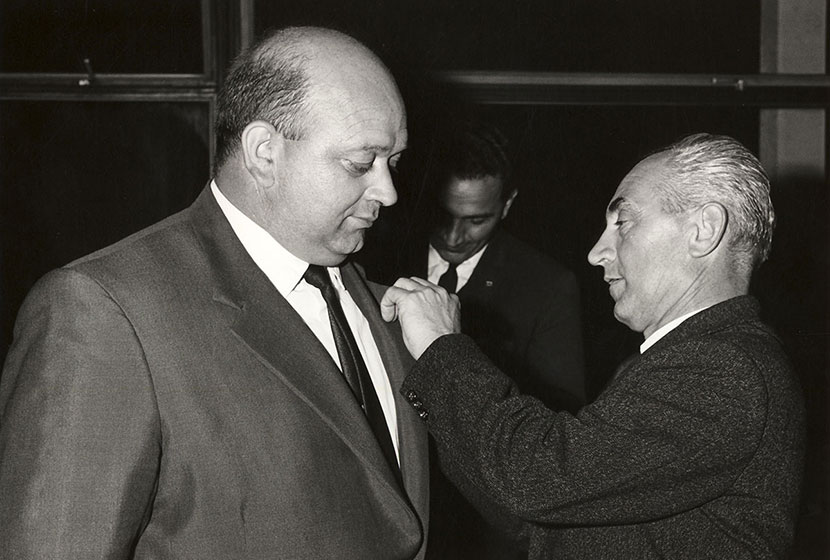 1966. Franco pins on Giancarlo Cecchini his 10-year long service badge.